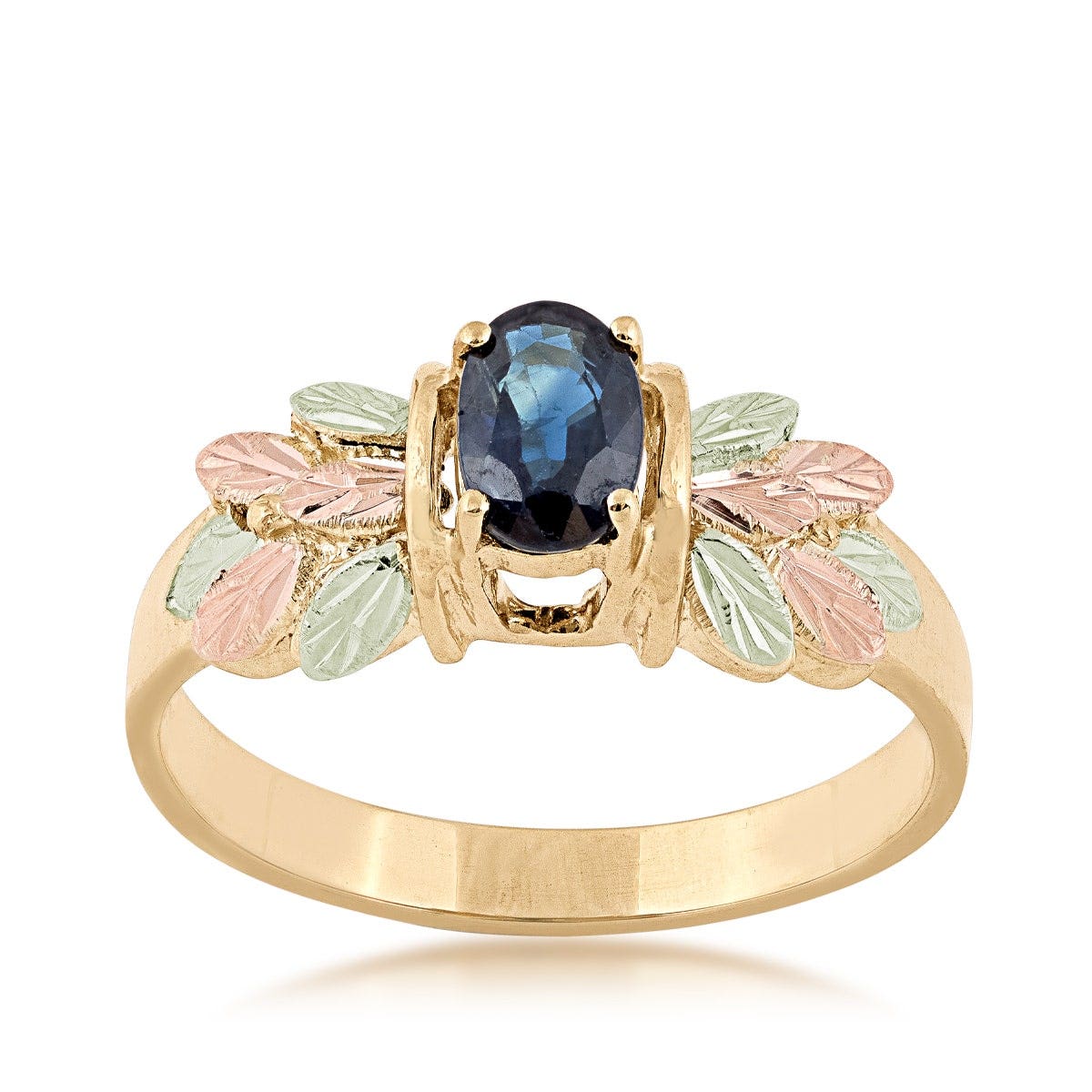 Oval sapphire yellow gold ring with pink and green gold leaves